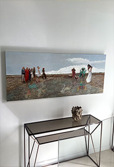 a couch in a room and paintin on the wall
